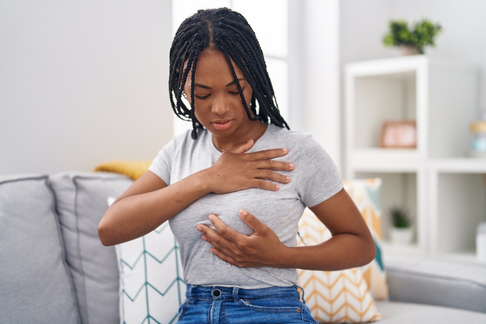 A lady examining her breasts